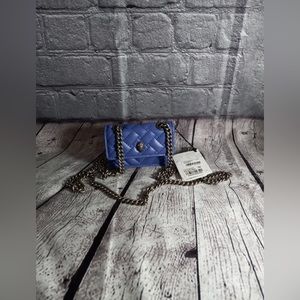 - Kurt Geiger London Micro Kensington Quilted Crossbody Bag
KURT GEIGER LO…